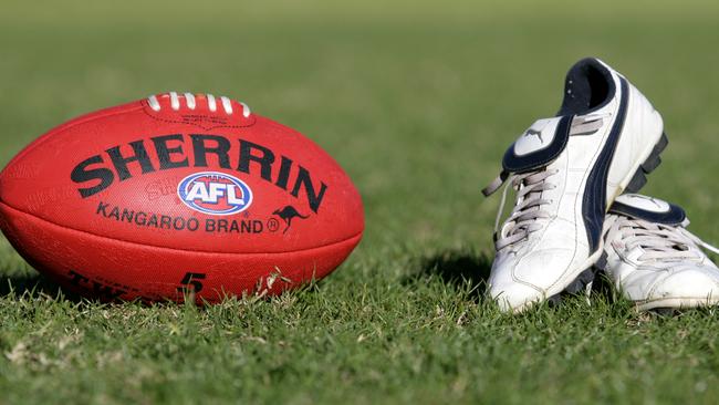 Generic AFL Sherrin football and football boots. sport /