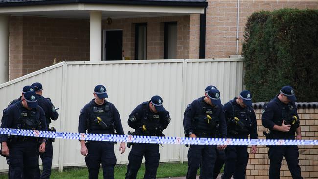 SYDNEY, AUSTRALIA : NewsWire Photos - DECEMBER 30 2024; The Riot Squad is seen dong a line search at the crime scene on St Johns road in Canley Heights where emergency services were called at aprox 6.50pm (Sunday 29 December 2024), following reports of shots fired. A man believed to be aged in his 30Ãs was treated at the scene by NSW Ambulance paramedics for gunshot wounds; however, he died at the scene. Fairfield City Police Area Command attended and established a crime scene. A short time later, emergency services were called to an abandoned car on fire on Bathurst Street, Wakeley. Investigations into the incidents which are believed to be linked Ã are underway. Picture: NewsWire/ Gaye Gerard