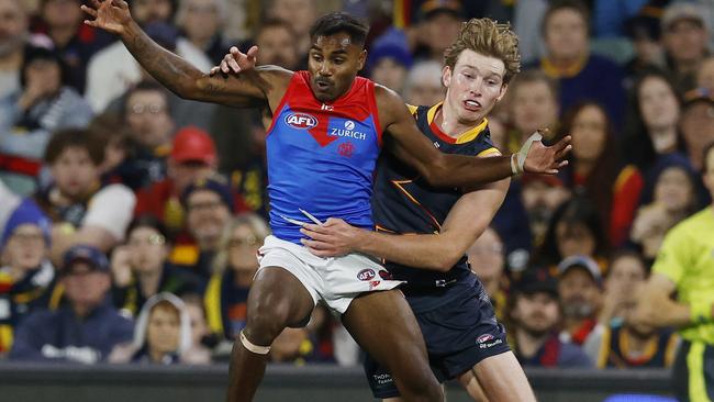 MELBOURNE , AUSTRALIA. April 4, 2024.  AFL Gather Round. Round 4.  Adelaide vs Melbourne at the Adelaide Oval.   Kysaiah Pickett of the Demons and Max Michalanney of the Crows during the 2nd qtr.    . Pic: Michael Klein