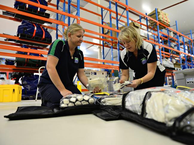 Jodi-May Jones and Jody Bellette from the Darwin-based National Critical Care and Trauma Response Centre (NCCTRC) begin packing their mobile hospital for deployment into Tacloban, Philippines, which has been devastated by typhoon Haiyan.