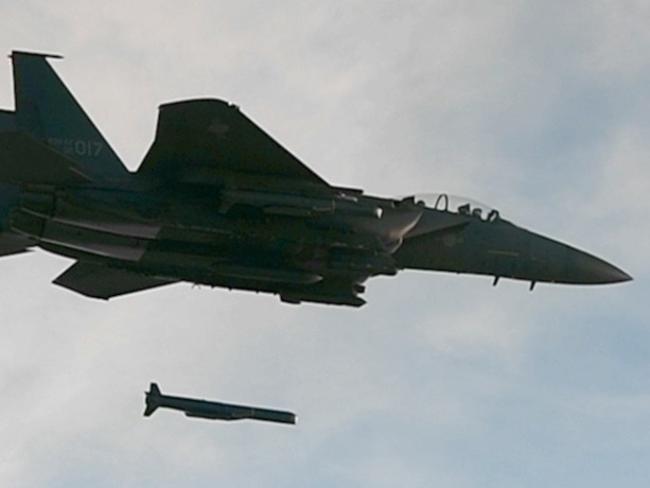 A SLAM-ER long-range air-to-ground missile is launched from an F-15K fighter jet during a combined live-fire drill at South Korea's east coast today. Picture: Yonhap