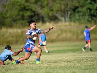 Brothers player Loia Fetaoai tries to escape the Swifts tackler during last weekend's A-Grade thriller at Purga. Brothers won 32-30. Picture: Cordell Richardson