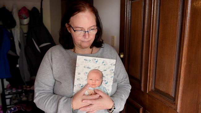 16/8/2018. Julie-Ann Pope poses for photographs with a photograph of her baby boy Joshua Nottle in her Adelaide Hills home, Adelaide. Julie-Ann is still searching for justice as the now discredited forensic pathologist Colin Manock concluded against medical and police advice that Joshua died of natural causes (bronchial pneumonia) despite him having horrific injuries including a broken back. Tracey Nearmy/The Australian