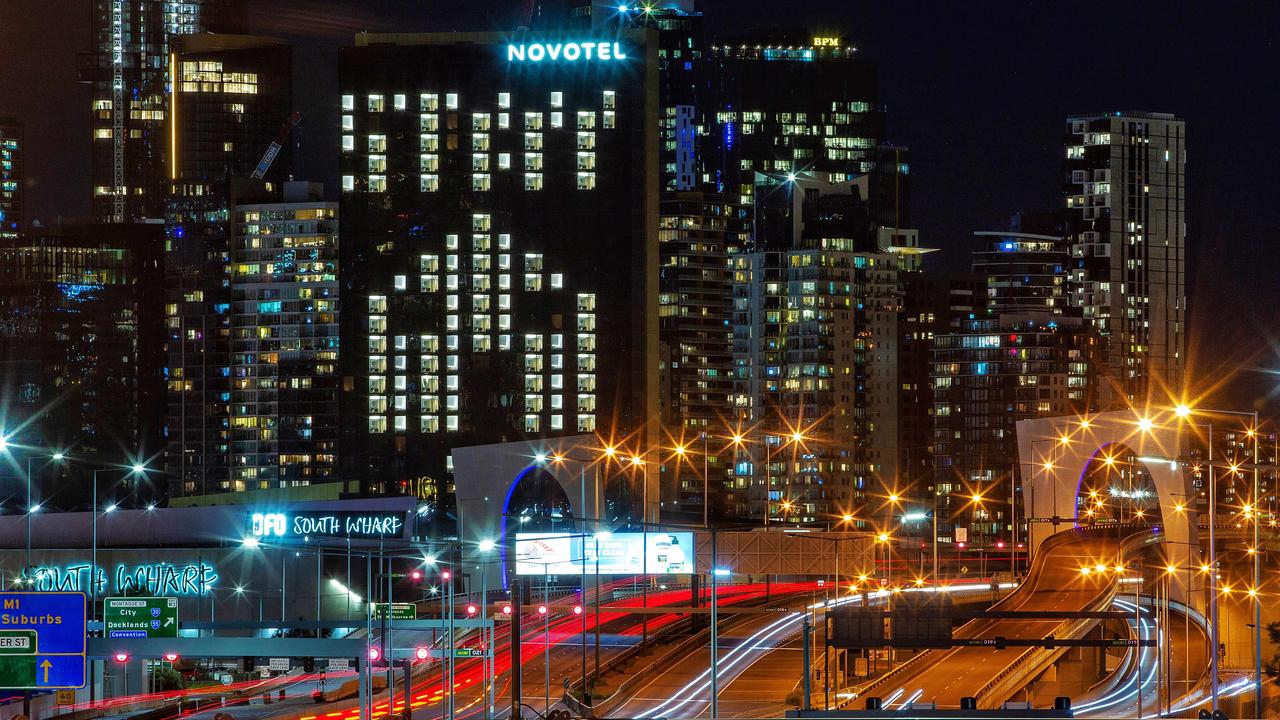 The Novotel South Wharf lights its windows in a message to Melbourne to ‘Stay Home’ under stage 4 lockdown. Picture: Mark Stewart