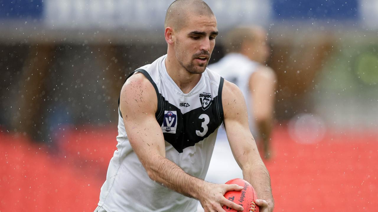 Jacob Dawson gets a kick away. Picture: Russell Freeman/AFL Photos via Getty Images