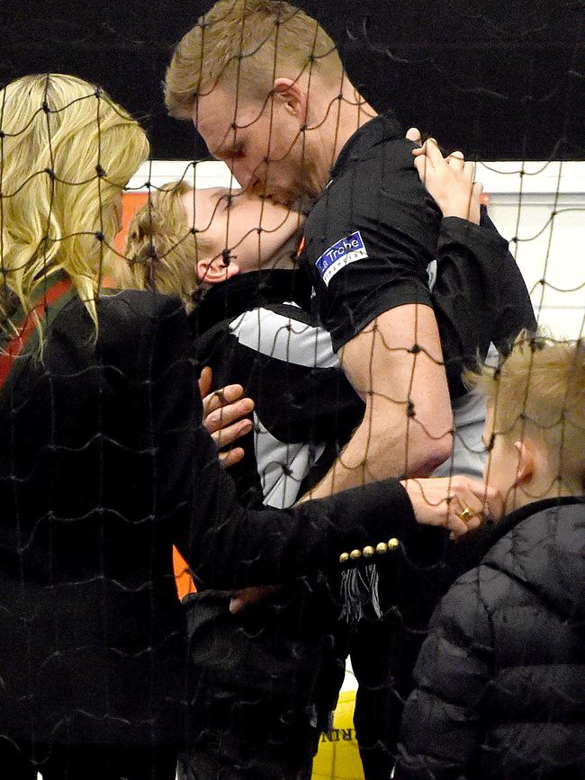 Collingwood coach Nathan Buckley with his sons Jett and Ayce and wife Tania after Collingwood lost the 2018 Grand Final. Picture: Nicole Garmston