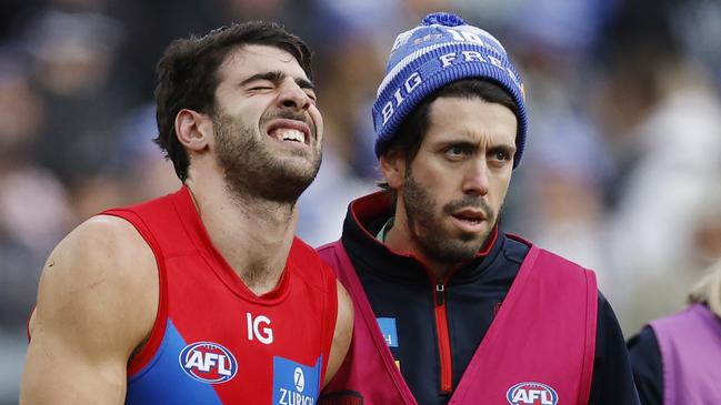 Big Freeze at the G. Collingwood vs Melbourne at the MCG. Christian Petracca of the Demons in pain after copping a Darcy Moore knee in the ribs late in the 1st qtr. . Pic: Michael Klein