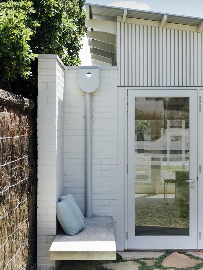 The exterior concrete bench mirrors the one inside.