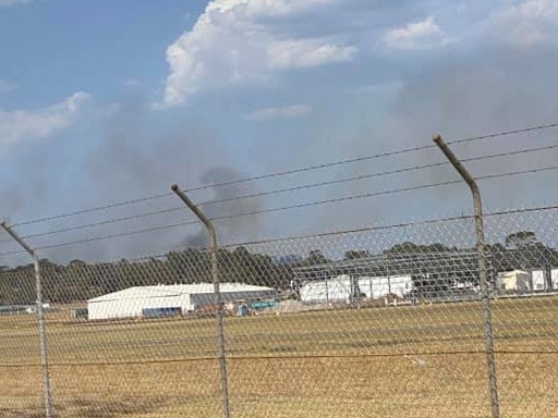 Smoke from the reserve is seen from Bankstown Airport link road. Picture: Kyra Louise Mann