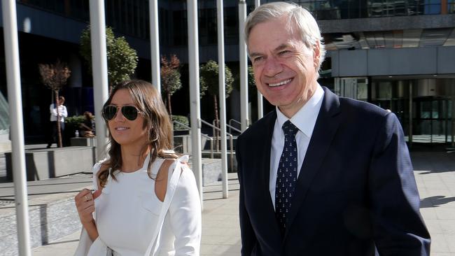 Michael Kroger leaving Federal Court with his personal assistant Carlie Boal. (David Geraghty/The Australian)
