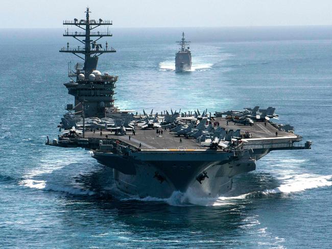 Aircraft carrier USS Nimitz and the guided-missile cruiser USS Philippine Sea in formation during a Strait of Hormuz transit in September 2020. Picture: Elliot Schaudt / US NAVY / AFP.