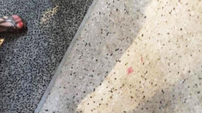 Spot the lipstick stain on the footpath – the woman and her friends found only a smudge from the lipstick tip when they returned to the scene of the offence which cost her $243 for littering earlier.