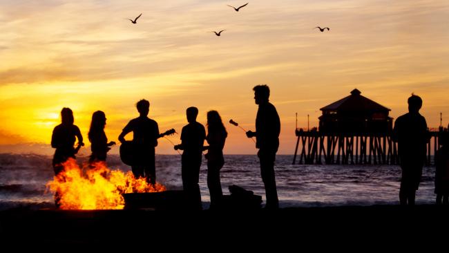 Not just about the water itself. At Huntington beach there are bonfire pits, an iconic pier and the nearby Bolsa Chica Ecological Refuge, where you can take a tour. Picture: Visit California