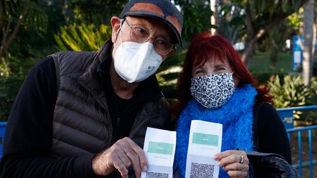 Israelis shows their "green pass" (proof of being fully vaccinated against the coronavirus) before entering the Green Pass concert for vaccinated seniors, organised by the municipality of Tel Aviv. Picture: AFP