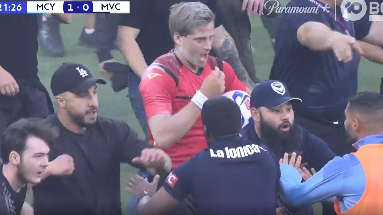 Alex King tries to leave the ground as fans stormed the pitch at AAMI Park. Picture: Fox Sports