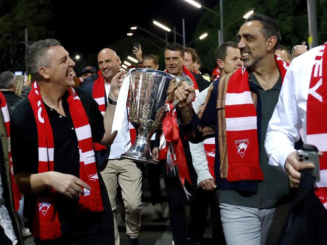 Leo Barry and Goodes with the premiership cup. Picture: Phil Hillyard
