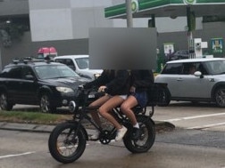 Two girls on an e-bike at the corner of Pittwater and Kentwell roads, North Manly. Picture: Jim O’Rourke