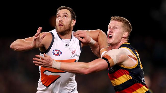 Reilly O’Brien played his best game of his young career against Giants giant Shane Mumford on Saturday night. Picture: James Elsby/AFL Photos/Getty Images