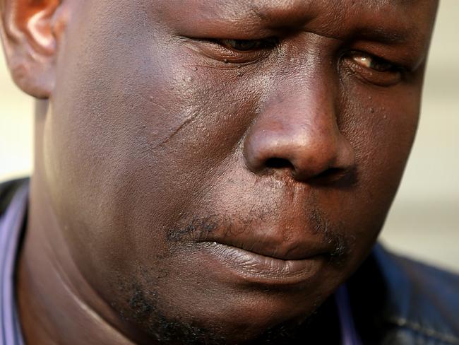 Joseph Manyang mourns after his children were killed. Picture: Mark Stewart