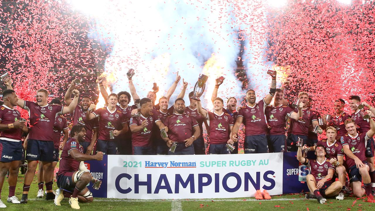 The Reds celebrate with the trophy after winning the Super RugbyAU Final. Picture: Getty Images