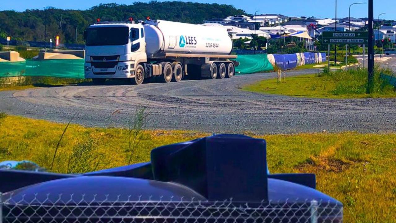 A tanker pumps sewage out of the holding tanks across the road from the local school and the proposed 159-lot development which has no town sewerage connections. Picture: Judith Kerr
