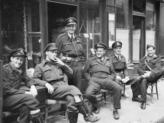 A moment of relief amid the horror … Australian Spitfire pilots of 453 Squadron, RAAF, at a cafe in Bayeux, Normandy, in July 1944. Courtesy of the Australian War Memorial.