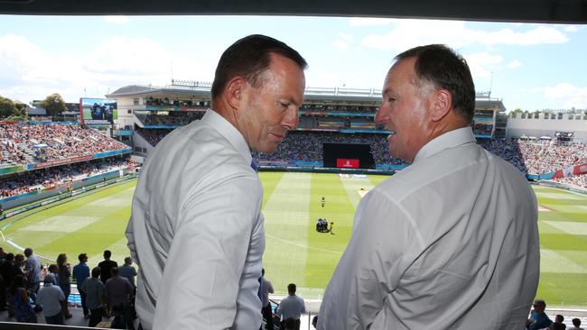 Then-Australian Prime Minister Tony Abbott (left) and New Zealand Prime Minister John Key attend a 2015 World Cup cricket match between Australia and New Zealand at Eden Park in Auckland on Saturday, Feb. 28, 2015.Picture: AAP