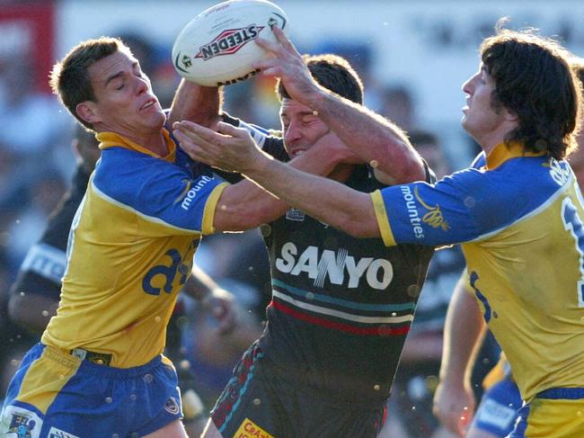 ## HAVE YOU /CHECKED COPYRIGHT /CLEARANCE ?? 07 Sept 2003 - Penrith Panthers vs Parramatta Eels @ Penrith Stadium. Craig Gower (C) is tackled by John Morris (L) and Nathan Hindmarsh. PicGregg/Porteous. sport rugby league nrl action