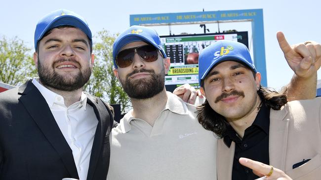 Caulfield Guineas horse race meeting, Caulfield, Victoria, Saturday 12th October 2024. Faces in the crowd. Pictured enjoying the race meeting are Alex, Stephen and Filip. Picture: Andrew Batsch