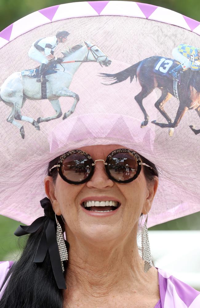 Racegoers dressed in vibrant hats and fascinators braved what could be the wettest Ascot on record for the first of five days of booze and betting. Picture: Chris Jackson/Getty Images