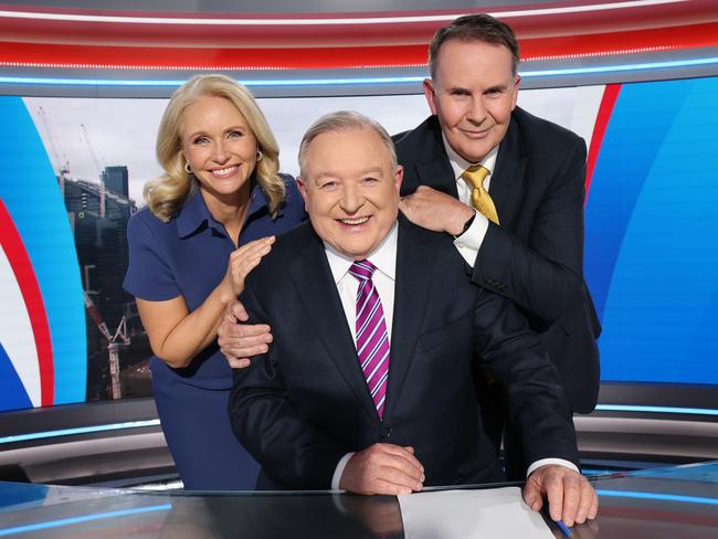 Livinia Nixon and Tony Jones with newsreader Peter Hitchener after his last weeknight news bulletin. Picture: David Caird