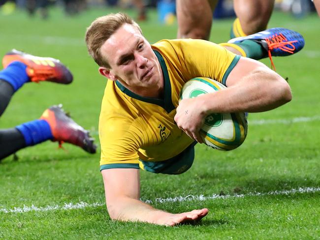 Dane Haylett-Petty dives over to score a try for the Wallabies. Picture: AAP Image/David Gray