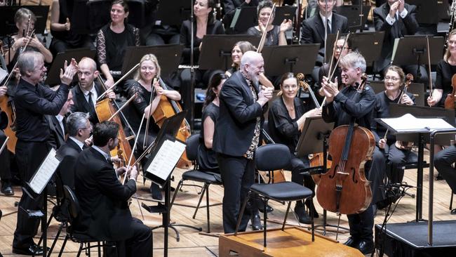 Composer Brett Dean (centre) congratulates cellist Alban Gerhardt at the premiere of his cello concerto while the SSO’s chief conductor David Robertson (left) looks on. Picture: Daniela Testa