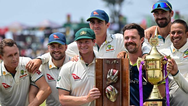 Australia's players with the trophies after their win at the end of the second Test against Sri Lanka at the Galle International Cricket Stadium. Picture: Ishara S. Kodikara/AFP