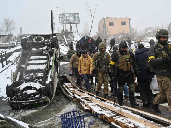 Thousands of people, including soldiers, are using the improvised path. Picture: AFP