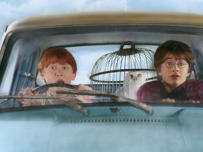 Actor Daniel Radcliffe (r) with Rupert Grint (l) in scene from film Harry Potter and the Chamber of Secrets. /Films/Titles/Harry/Potter/and/the/Chamber/of/Secrets