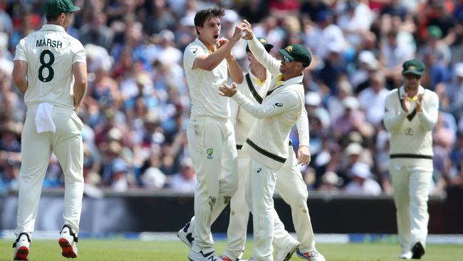 Pat Cummins celebrates with David Warner after dismissing Joe Root during Day Four of the 3rd Test Match. Picture: Getty Images.