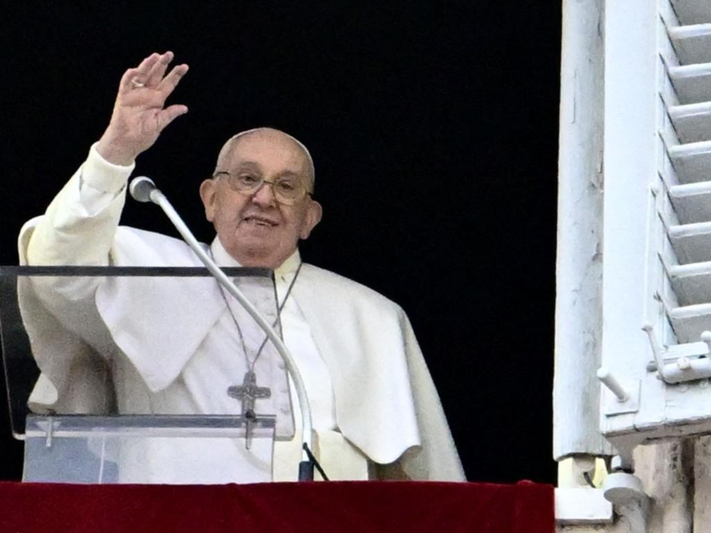 Pope Francis addresses the crowd from the window of the apostolic palace overlooking St. Peter's square. Picture: AFP
