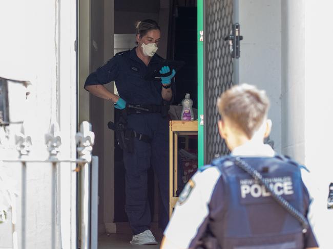 Police inspect a unit on Raglan St, Waterloo where a 17-year-old girl was injured. Picture: Thomas Lisson