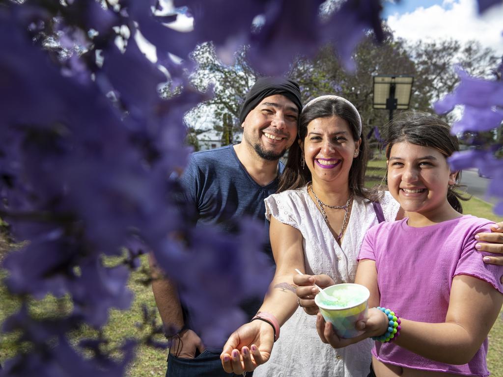 Celebrating the Jacarandas are (from left) Adam, Selin and Lina Thomas who travelled from Toowoomba to get in on the atmosphere of Jacaranda Day in Goombungee, Saturday, November 5, 2022. Picture: Kevin Farmer