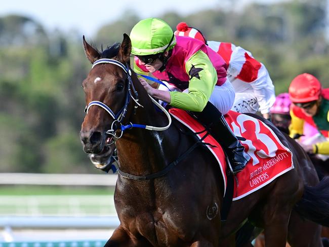 Knight's Choice wins the Group 3 Winx Guineas on the Sunshine Coast for trainers Sheila Laxon and John Symons and apprentice jockey Jaden Lloyd. Picture: Grant Peters, Trackside Photography