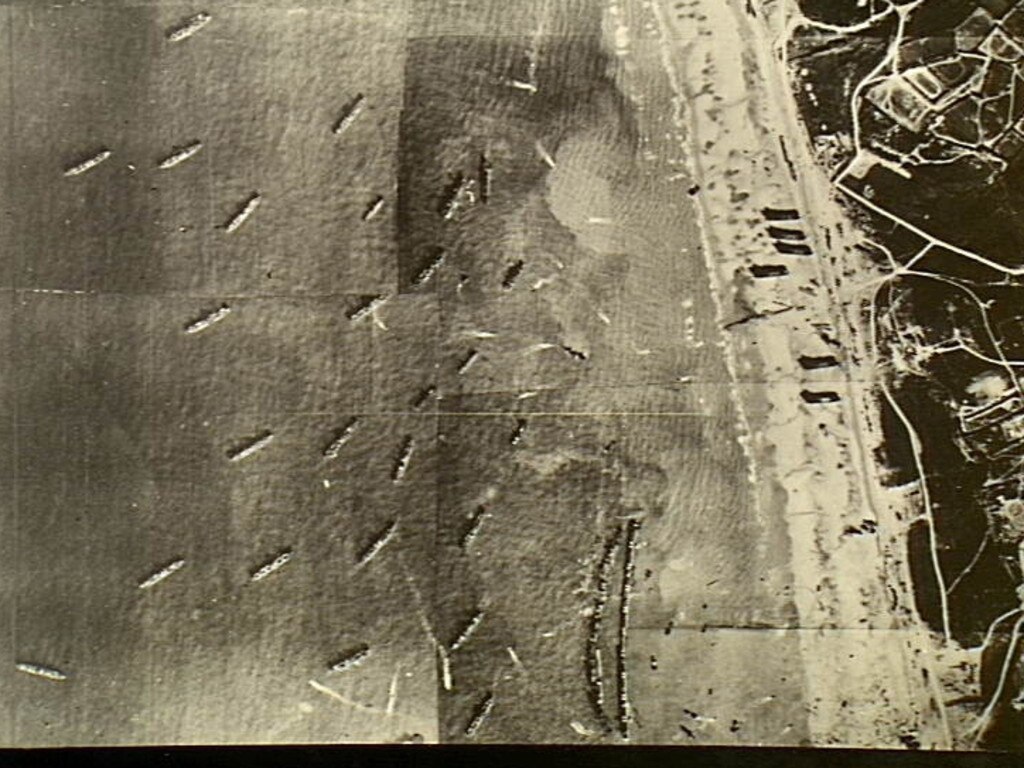 Securing the skies … an aerial view of Allied shipping and the artificial harbour at Arromanches, Normandy, towed across the Channel as part of Overlord to get supplies ashore quickly. Picture: the Australian War Memorial