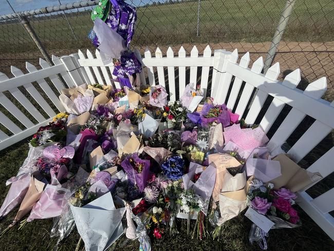 Tributes left at the scene of the triple fatal crash in Maryborough.