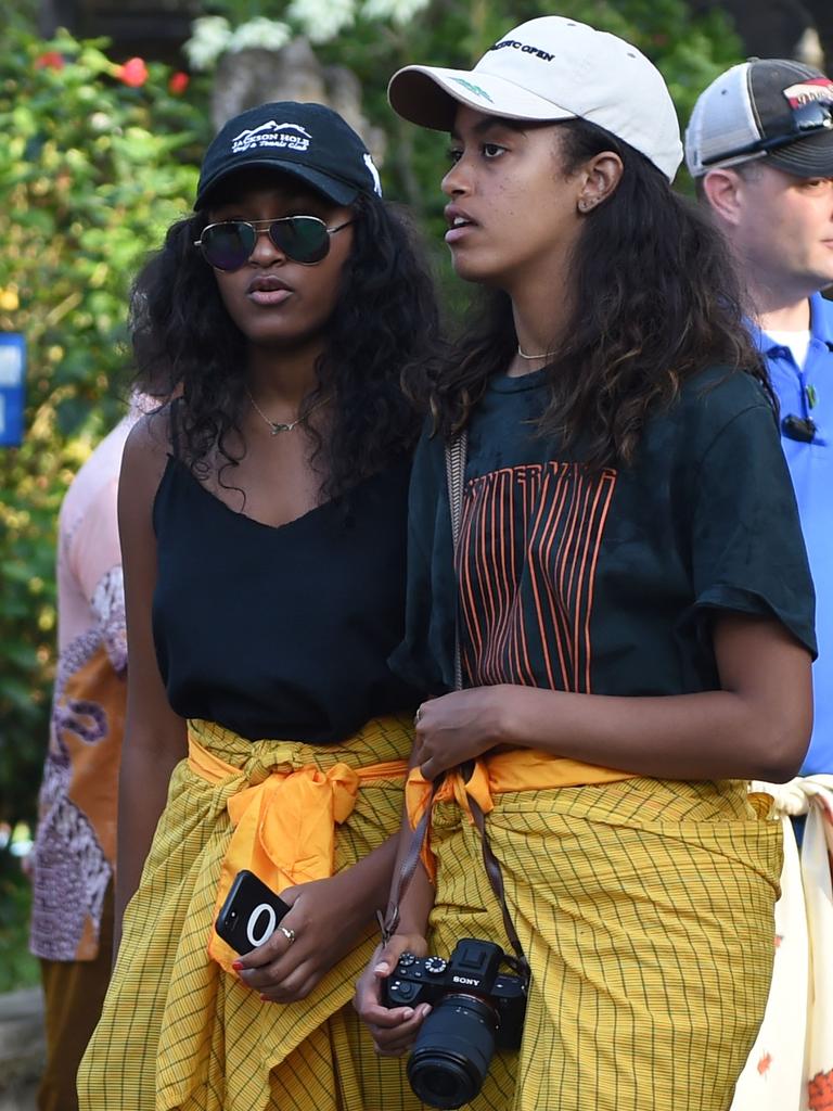 Sasha and Malia together. Picture: Sonny Tumbelaka/AFP