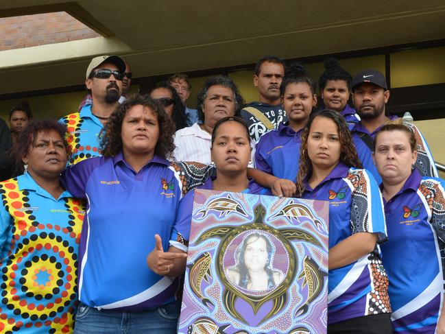 Amanda Kay Sauneys, 25, family with a photo of her, outside the Mackay Courthouse as her murderer Antony Daniel Morseu was sentenced to life in prison. Photo Lee Constable / Daily Mercury