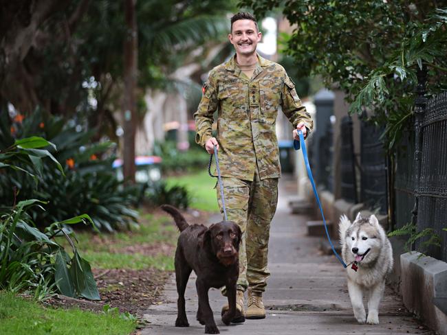 Captain Hugo Toovey with his dogs Ernie (brown labradoodle) and Iggy (Husky). Picture: Adam Yip