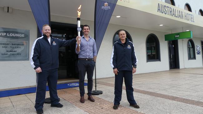 Runners Ben Hunt (left) and Sophie Thomson (right) passed the tap torch to owner Jackson Quinn at The Australian Hotel in Ballina.