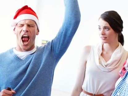 RendezView. A group of coworkers looking awkwardly towards their drunk colleague at the office Christmas party who is obviously having the time of his life. He is totally here to party. (Pic: iStock)