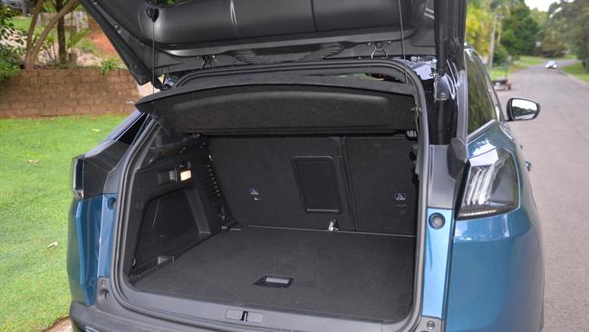 The model year 2021 Peugeot 3008 GT has a foot sensnor to automatically open the boot, as well as levers in the back to drop the seats 60-40.