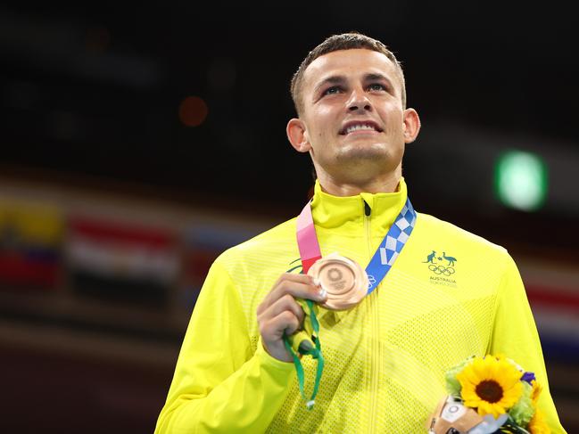 TOKYO, JAPAN - AUGUST 08: Harry Garside of Team Australia celebrates with his bronze medal during the victory ceremony for the Men's Light (57-63kg) Final on day sixteen of the Tokyo 2020 Olympic games at Kokugikan Arena on August 08, 2021 in Tokyo, Japan. (Photo by Buda Mendes/Getty Images)